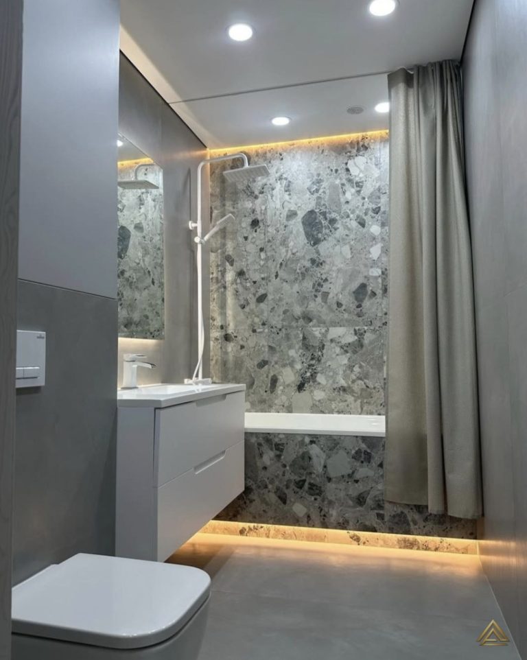 Projet de rénovation de salle de bain (carrelage effet terrazzo gris et mobilier blanc), réalisé par PRO BAT-IM, à Val-de-Marne.