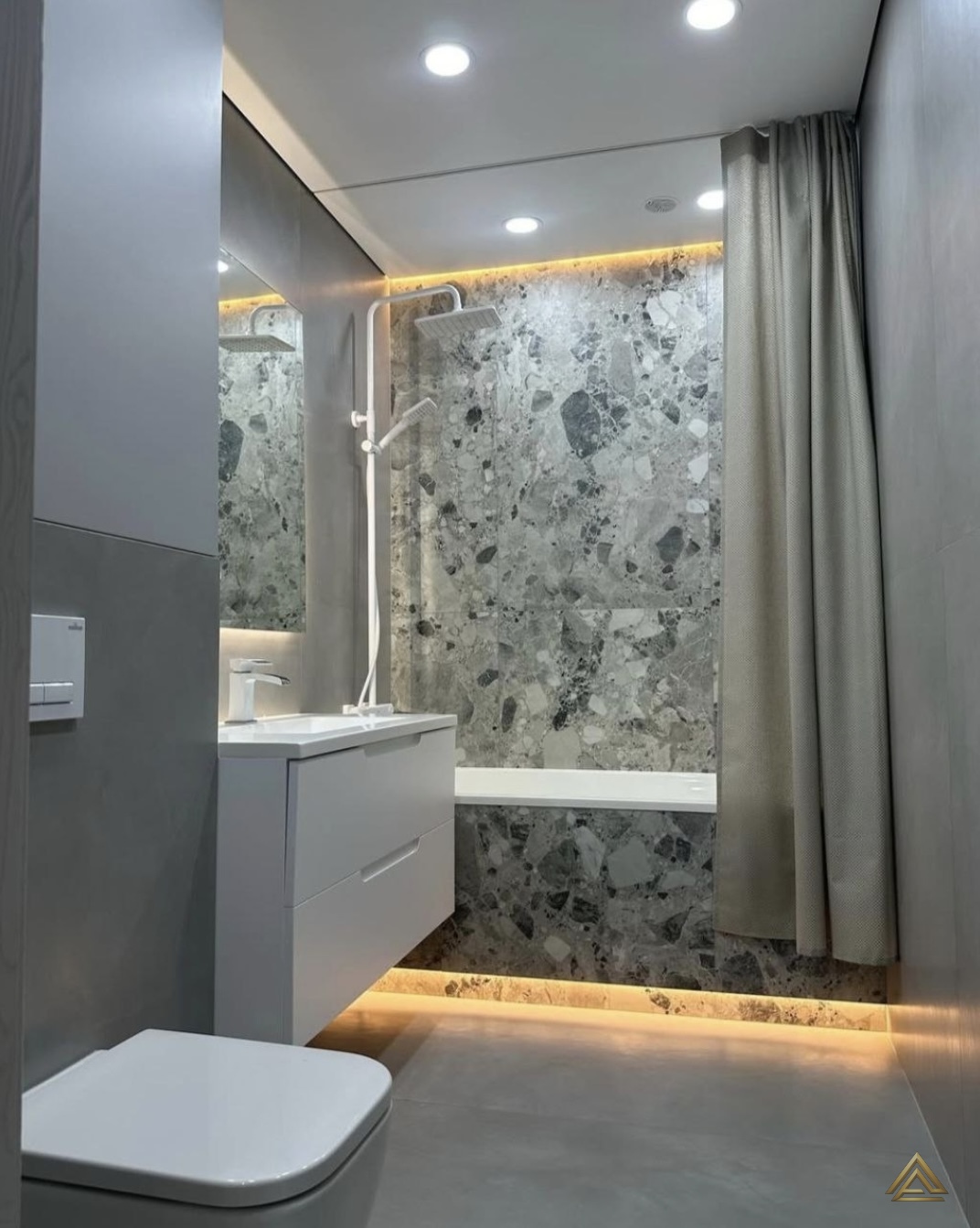 Projet de rénovation de salle de bain (carrelage effet terrazzo gris et mobilier blanc), réalisé par PRO BAT-IM, à Val-de-Marne.